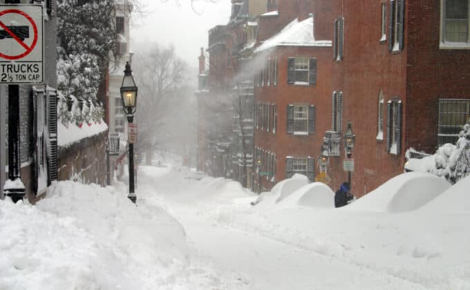 A residential street in Boston, Massachusetts, covered in a heavy fall of snow.