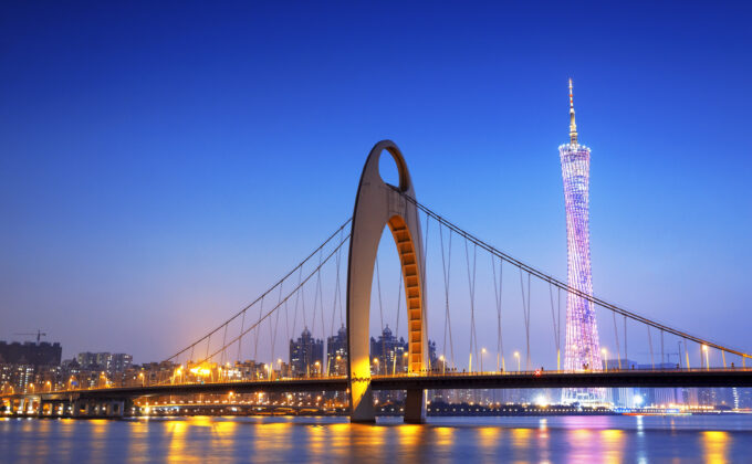 city bridge and skyline at dusk