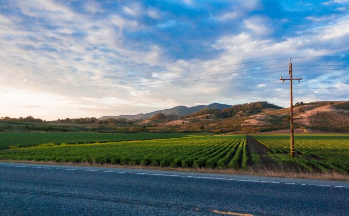 farm field with mountains