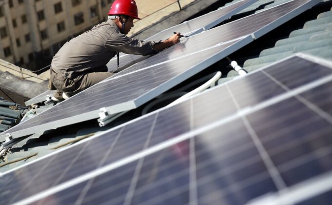 man working on rooftop solar panel|man working on rooftop solar panel|man working on rooftop solar panel