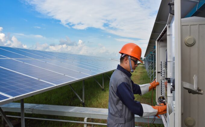 solar panels and worker|solar panels and worker|solar panels and worker