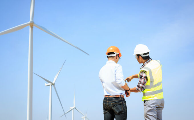 engineers with wind turbine