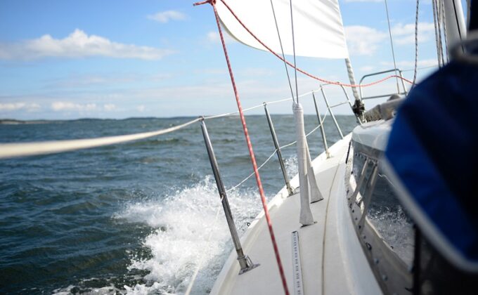 water and deck of a sailboat