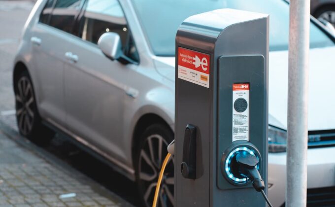 silver electric car charging on an amsterdam elektrisch charger|silver electric car charging on an amsterdam elektrisch charger