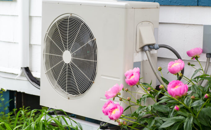 heat pump outside of house with flowers next to it|heat pump outside of house with flowers next to it