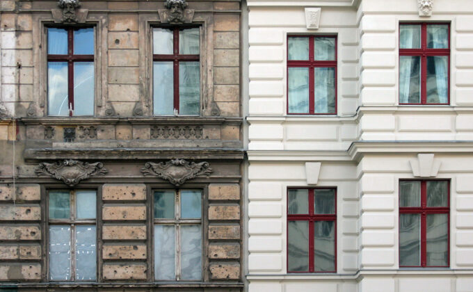 building facade with one side renovated and other side decrepit