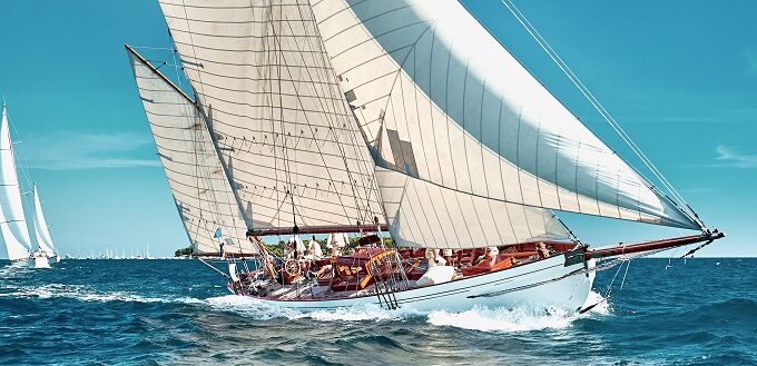 crew on regatta sailboat sailing on ocean under blue sky|crew on regatta sailboat sailing on ocean under blue sky|crew on regatta sailboat sailing on ocean under blue sky