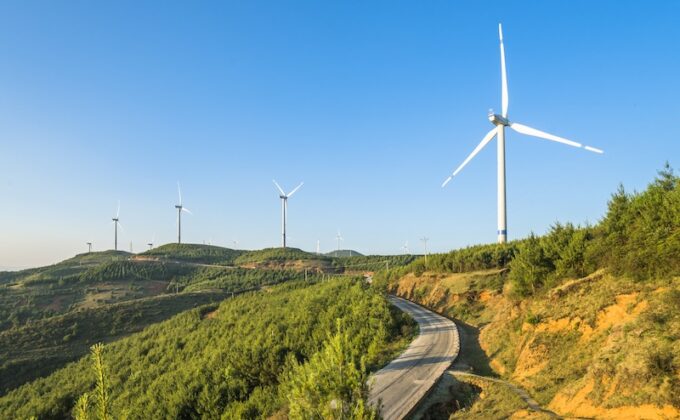 Wind turbine along road|