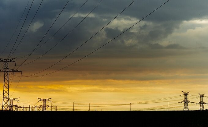 power lines silhouetted against stormy sky|Social welfare benefits of regionalisation by 2030|Aggregated tradeable interconnector capacity|Difference in upwards balancing energy price and day-ahead energy price