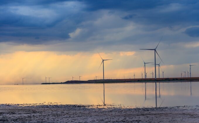 Wind turbines on a shore of the pink salty Syvash lake in Kherson region