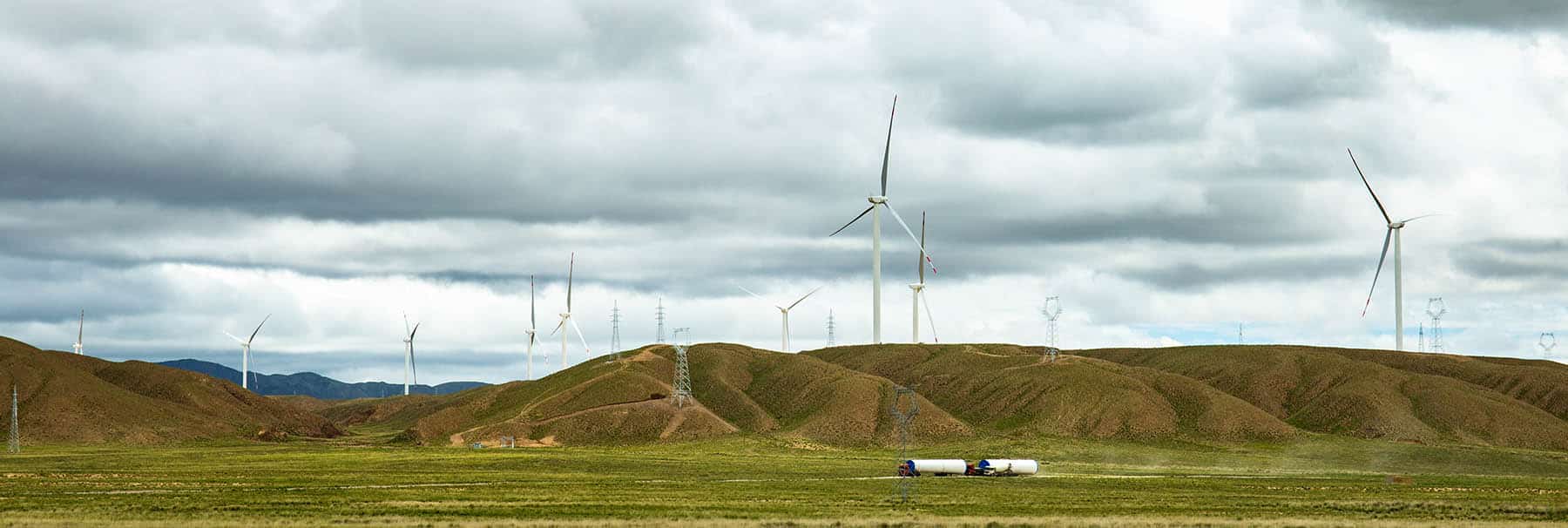 In the wilderness of Qinghai Province in Northwest China, many tall wind turbines continue to use wind energy to generate electricity.