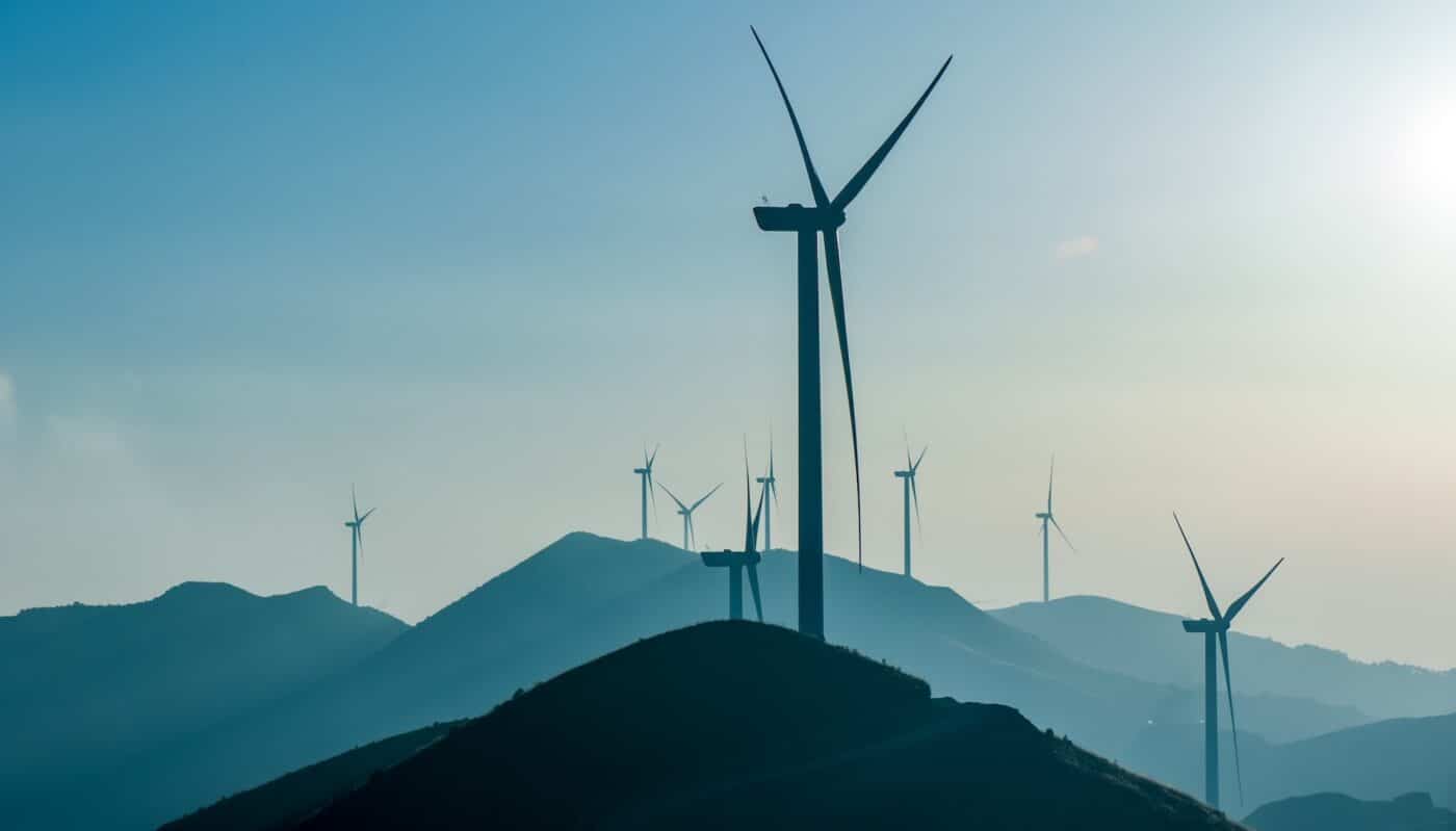 Wind turbines on sunny morning on a hillside