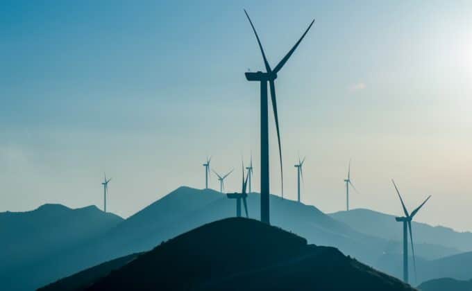 Wind turbines on sunny morning on a hillside